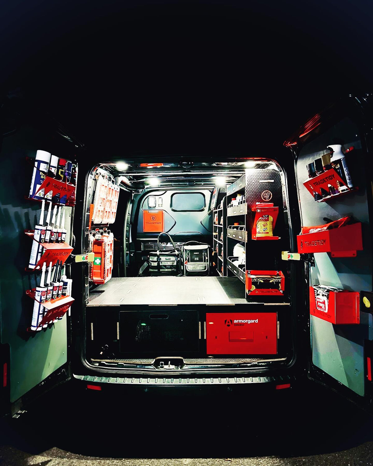 Rear of a working van organised with red TradeTidy holders