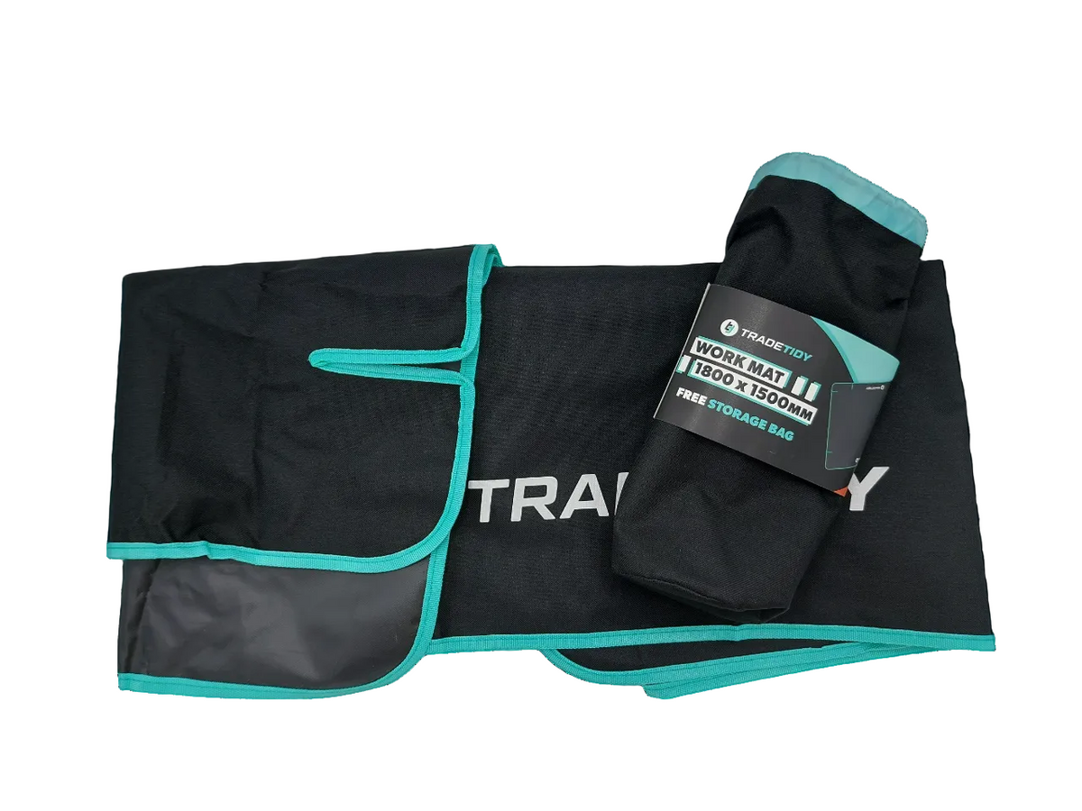 TradeTidy large work mat 1800 x 1500mm — black mat with teal edging shown folded beside its drawstring storage bag