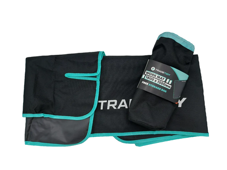 TradeTidy large work mat 1800 x 1500mm — black mat with teal edging shown folded beside its drawstring storage bag