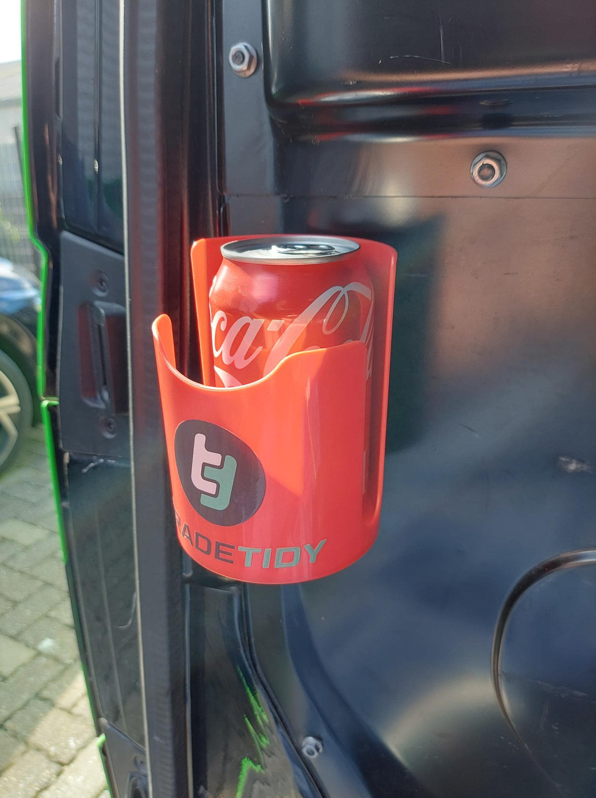 TradeTidy - red soda can in a red magnetic cup holder mounted on a metal car wall