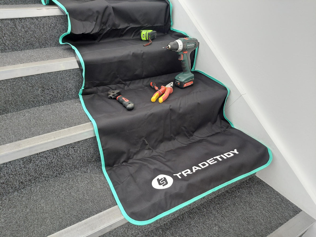 Work mat on staiwith tools on stairs, featuring the TradeTidy brand.