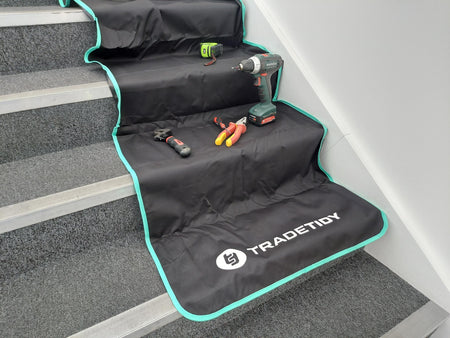Work mat on staiwith tools on stairs, featuring the TradeTidy brand.