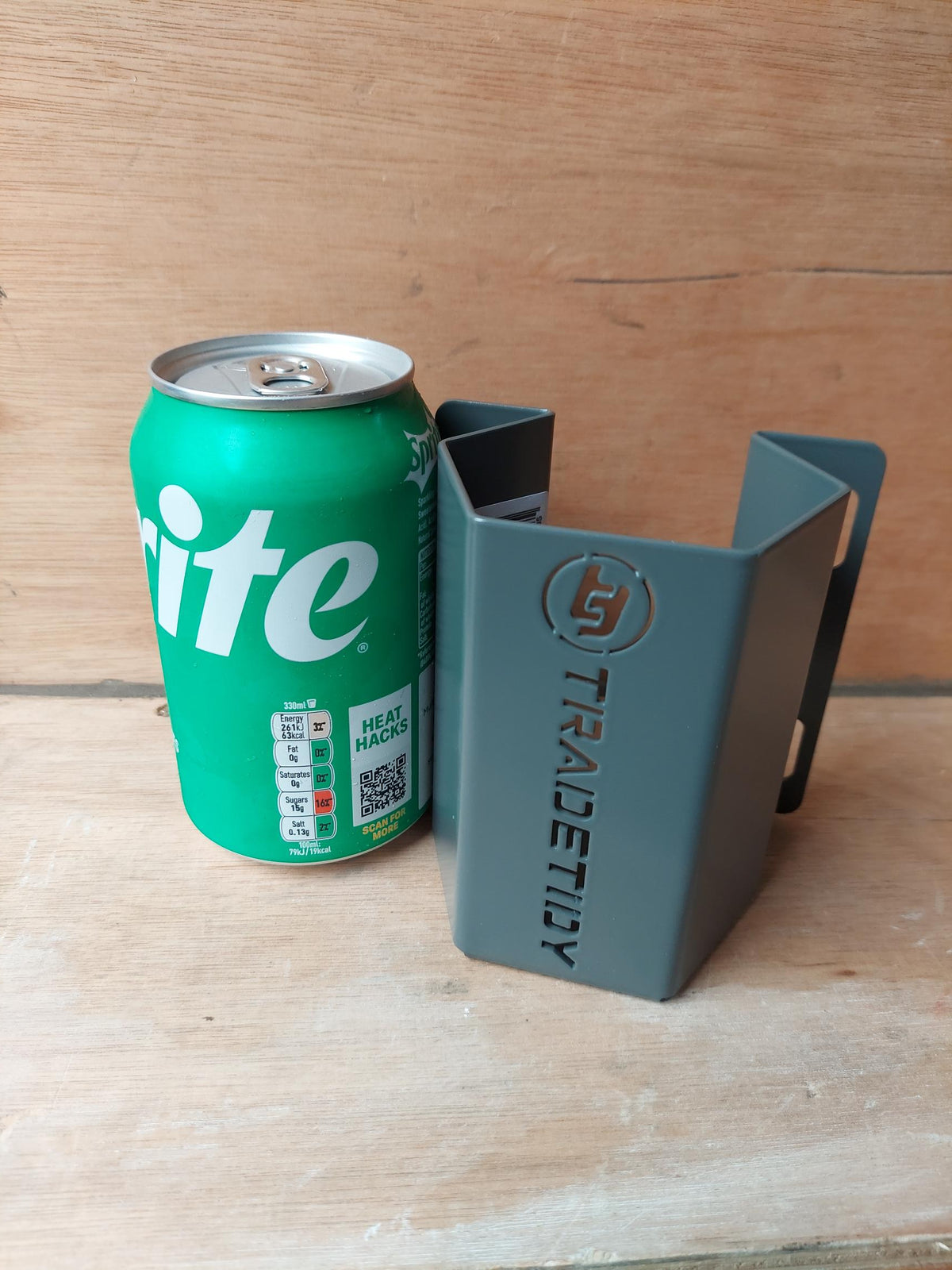 Sprite can next to a grey TradeTidy can holder