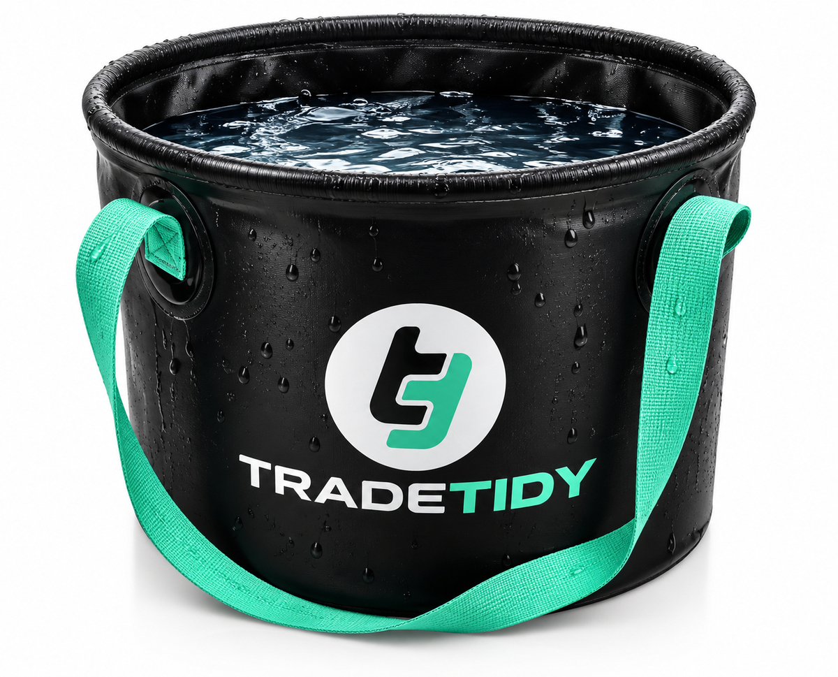 Black TradeTidy collapsible bucket full of water, with teal carry handles and beaded water on the sides