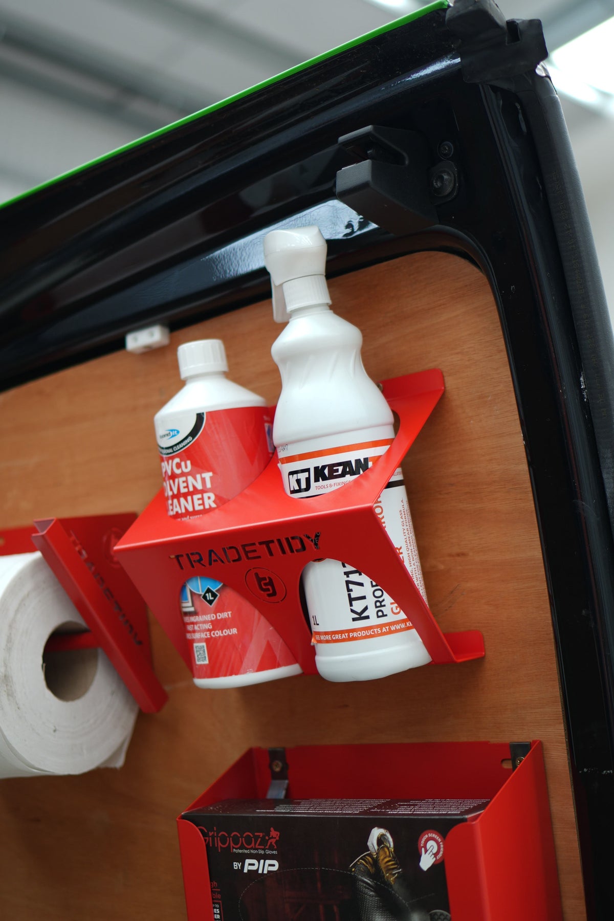 TradeTidy red glass and PVCu cleaner holder with two solvent bottles, mounted on a plywood van door