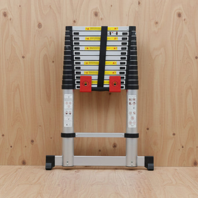 TradeTidy - telescopic ladder in a red ladder bracket on a wooden wall