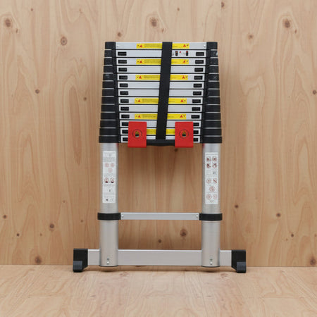 TradeTidy - telescopic ladder in a red ladder bracket on a wooden wall