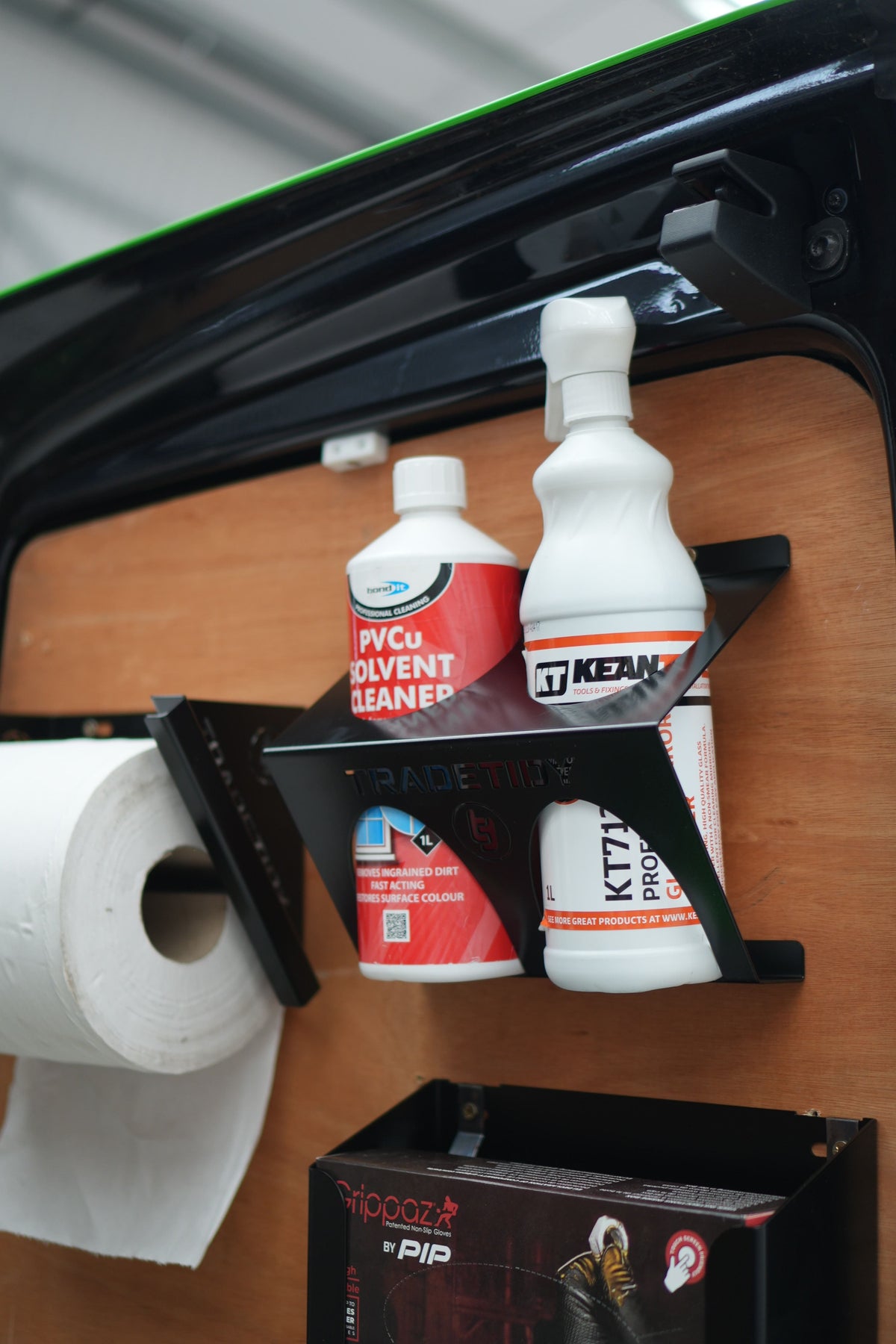 TradeTidy black glass and PVCu cleaner holder with two solvent bottles, mounted on a plywood van door