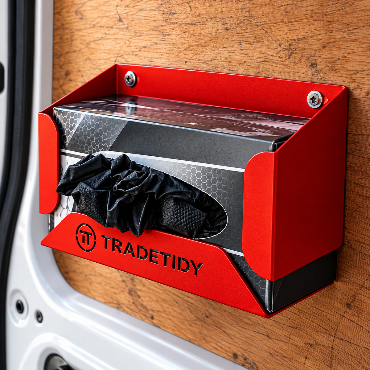 TradeTidy red Glove Box Holder fitted to the plywood lining inside a work van with gloves ready to pull