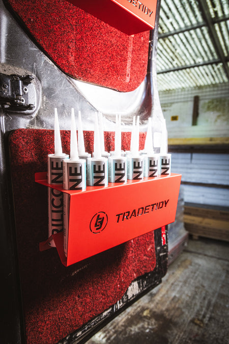 TradeTidy - silicone tubes in a red silicone tube holder hanging on a workshop van's door