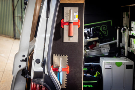 TradeTidy - Car door with mounted trowel in a workshop setting