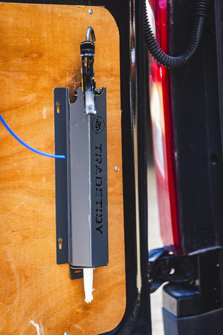 TradeTidy - silicone gun in a black silicone holder mounted on a workshop van