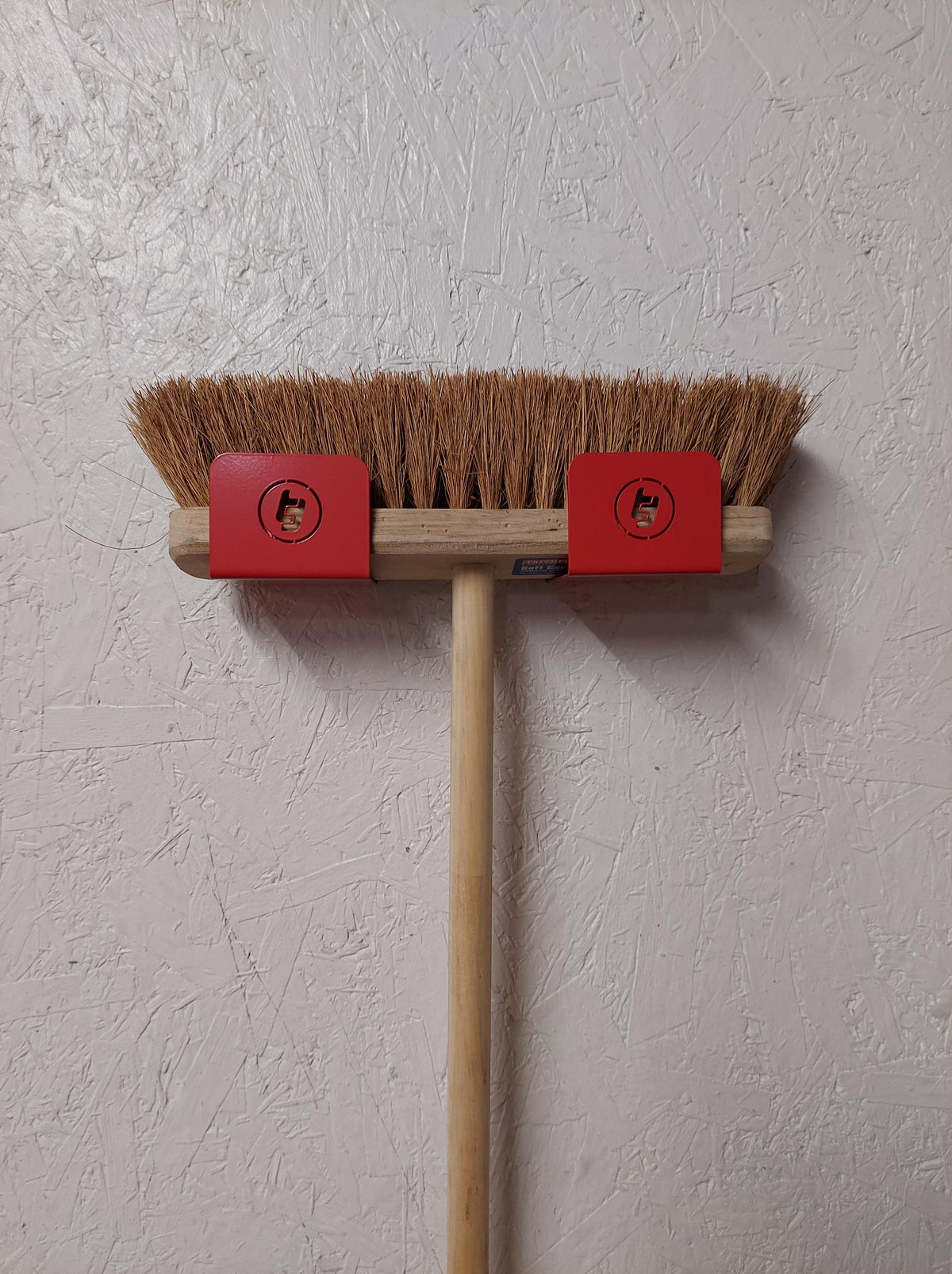 TradeTidy - Broom mounted in a Red Broom Holder Brackets