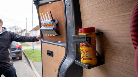 TradeTidy - wipes in holder mounted on a wooden wall in a workshop van