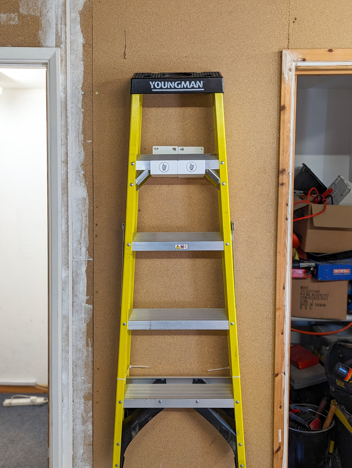 TradeTidy - Ladder mounted in a Ladder Brackets on a wooden wall