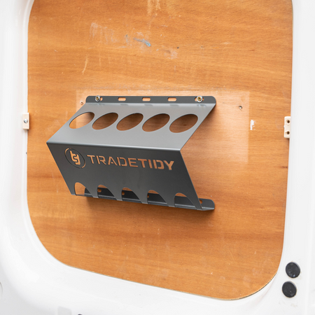 TradeTidy - grey Mastic & Silicone Tube Holder Installed on a Wooden Wall