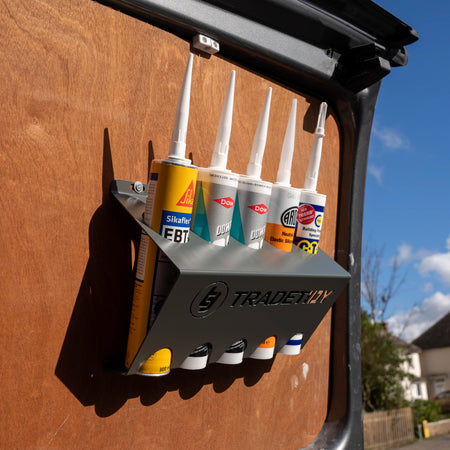 Silicone Tubes and Adhesive Tubes in a grey TradeTidy Tube Holder mounted on a workshop Van's door